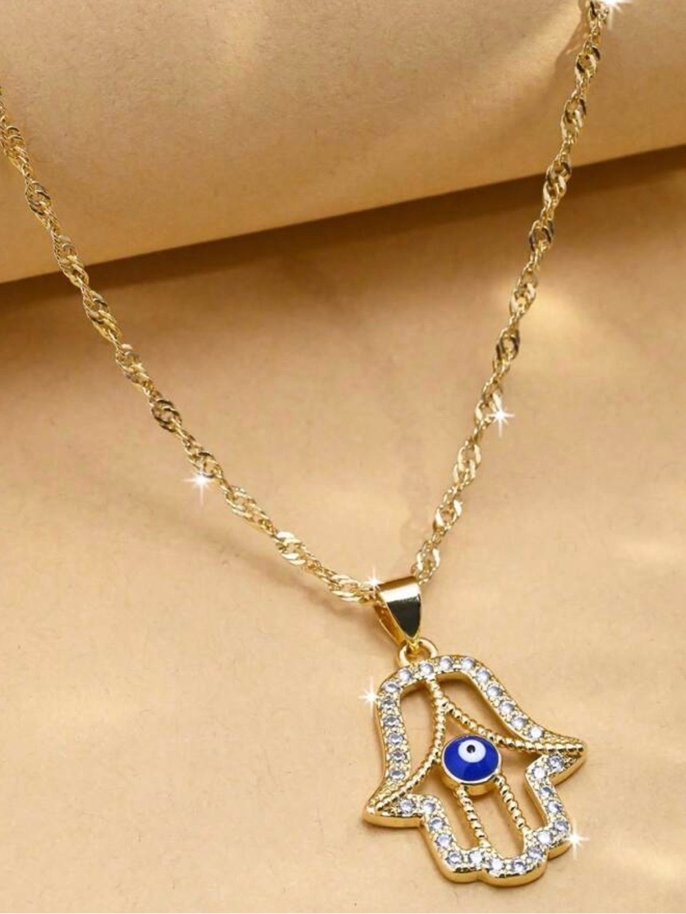 Gold Hamsa Hand Necklace with Blue Evil Eye Pendant